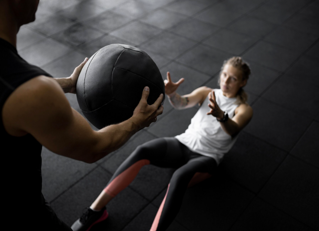 Close-up-people-training-with-ball-e1776245933694